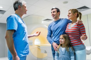 Family talking to a doctor about MRI scan.